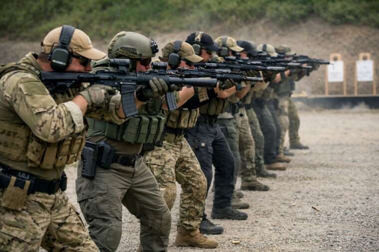 Tactical operators conducting firearm training at a shooting range